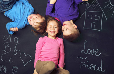 Three cheerful kids playing together