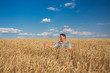 © Ryzhkov Oleksandr - Happy smiling caucasian  old farmer standing in wheat fields