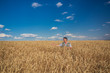 © Ryzhkov Oleksandr - Happy smiling caucasian  old farmer standing in wheat fields
