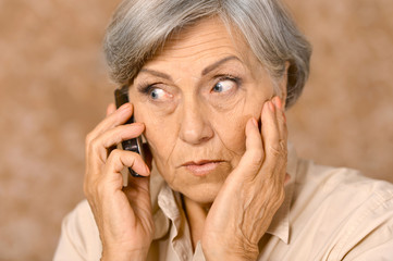 Wall Mural - Aged woman talk on phone