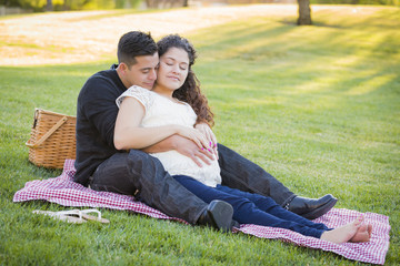 Wall Mural - Pregnant Hispanic Couple in The Park Outdoors