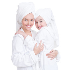 Sticker - happy mother and young daughter in white dressing gown