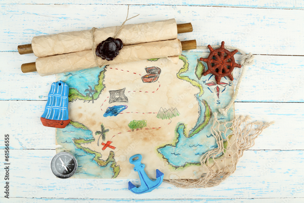 Treasure map with sea accessories, on wooden background