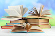 Stacks of books on table on natural background