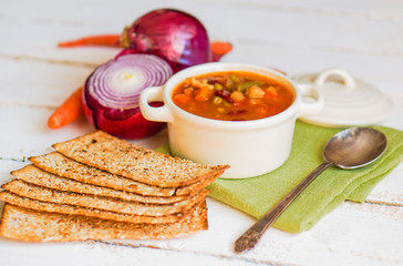 Wall Mural - Minestrone soup on wooden background