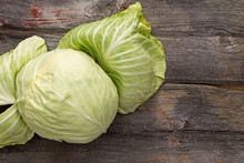 Fresh Green Cabbage On A Wooden Table