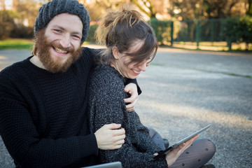 Wall Mural - young couple in love using tablet