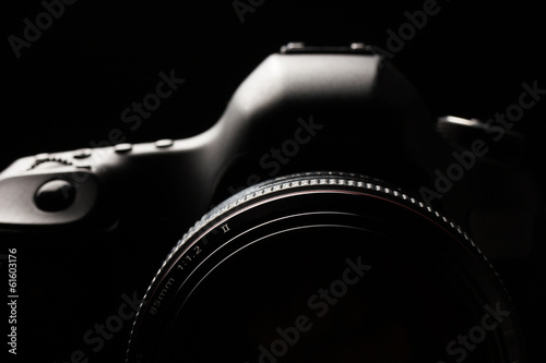 Fotomural Professional modern DSLR camera low key image