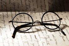 Old Glasses On A Letter
