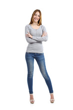 Full Body Of A Casual Happy Woman Standing Wearing Jeans