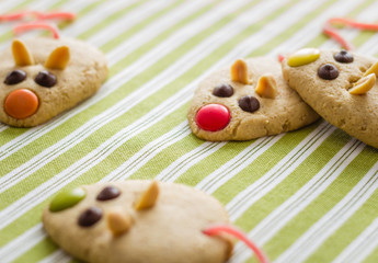 Wall Mural - Cookies with mouse shaped and red licorice tail