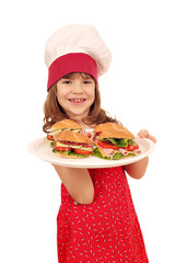 Wall Mural - happy little girl cook with sandwiches