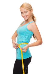 Poster - sporty woman with measuring tape