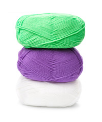 Wall Mural - stack of yarn skeins in green, purple, white colors on white bac