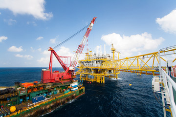 Large crane vessel installing the platform in offshore