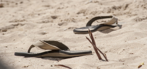 Sandals on white  sand beach