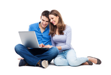 Canvas Print - Young couple with laptop computer