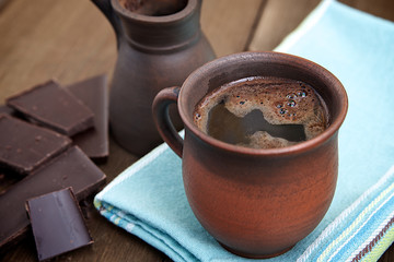 Wall Mural - Coffee in a brown ceramic cup