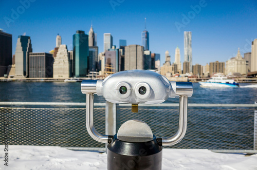 A binocular in Brooklyn Bridge Park view of New York city Poster
