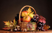 Beautiful Autumn Harvest In Basket And Leaves