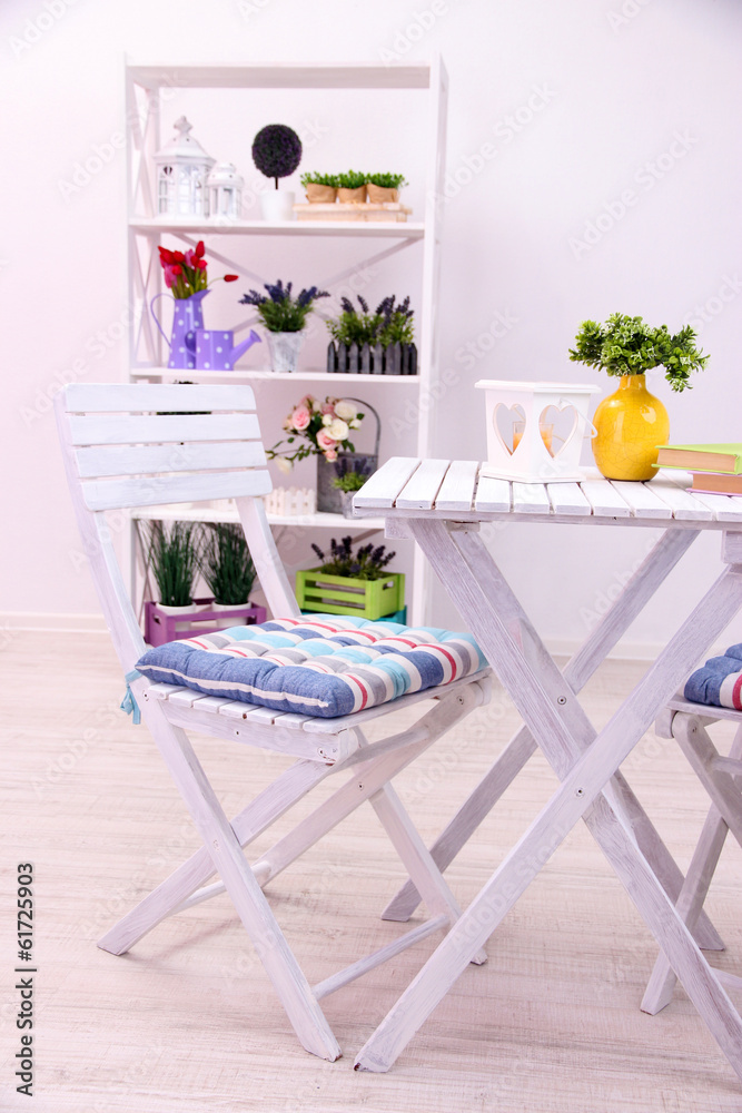 Garden chair and table with flowers