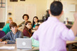 © Monkey Business - High School Students With Teacher In Class Using Laptops