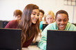 © Monkey Business - Group Of High School Students In Class Using Laptops