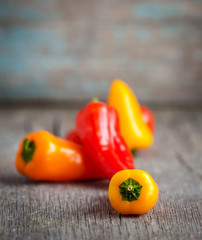 Wall Mural - Colorful mini peppers on  board.