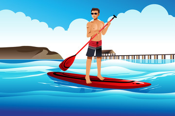 Poster - Man paddle boarding in the ocean