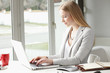 © sepy - Attractive business woman is typing on her keyboard