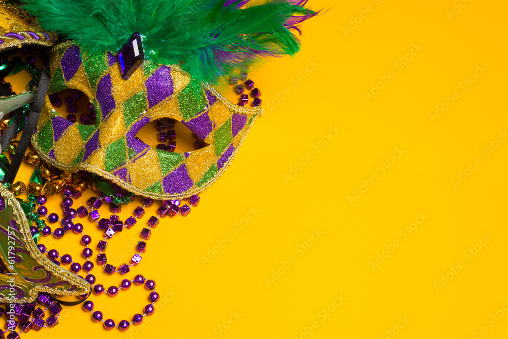 Colorful group of Mardi Gras or venetian mask on yellow - obrazy, fototapety, plakaty 