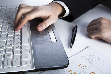 human hands on the notebook keyboard 2