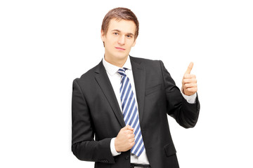 Poster - Young businessman in formalwear leaning against wall