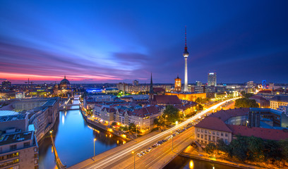 berlin skyline city panorama with traffic and sunset