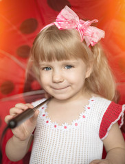 Cute little girl posing with umbrella.