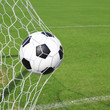 © somkanokwan - soccer ball in goal