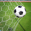 © somkanokwan - soccer ball in goal