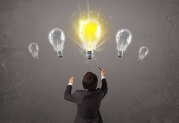 Business person having an idea light bulb concept