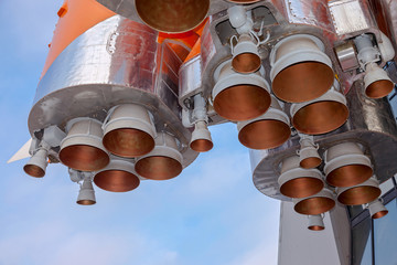Wall Mural - details of space rocket engine over blue sky background