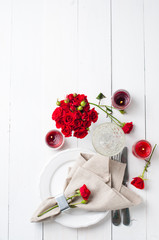 Wall Mural - Festive table setting with red roses