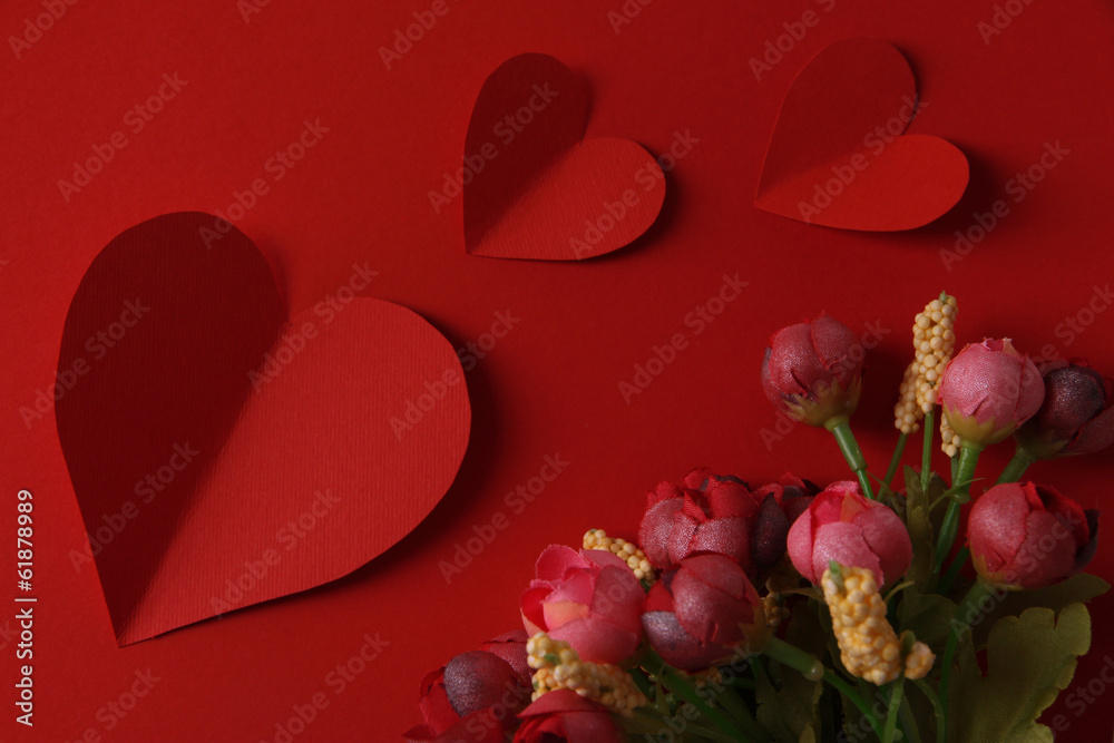 Paper hearts with flowers on red background