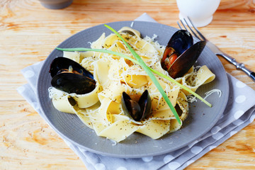 Poster - pasta with grated cheese and mussels