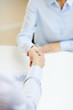 © Syda Productions - businesswoman and businessman shaking hands