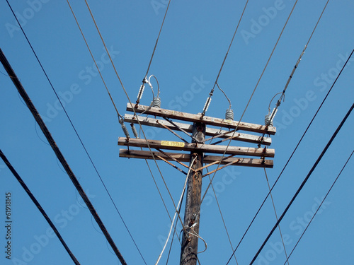 Fotografie, Obraz High Voltage Power Lines intersect at a wooden power pole
