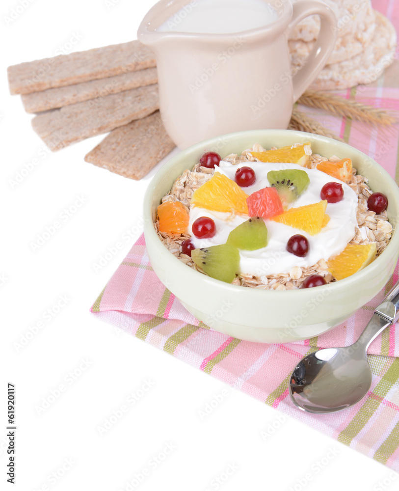 Delicious oatmeal with fruit in bowl on table close-up