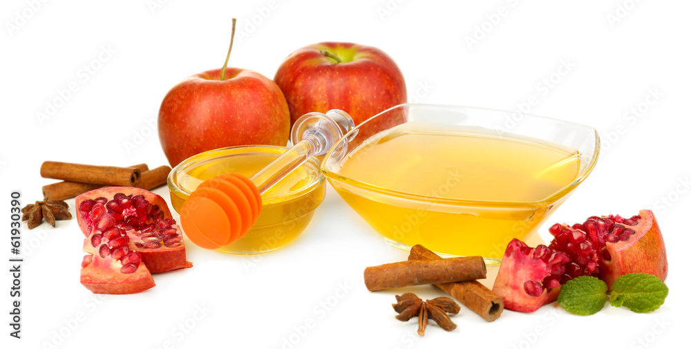 Sweet honey with pomegranate, apples and cinnamon isolated