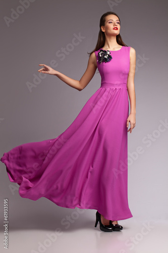 Girl in magenta dress. Portrait. Studio. Fashion Poster