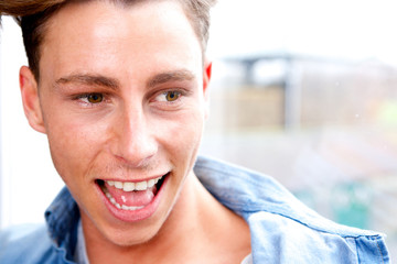 Wall Mural - Close up portrait young man laughing