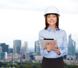 Wall Mural - young smiling businesswoman in white helmet