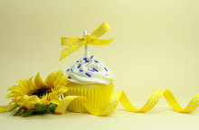 Yellow Theme Cupcake With Sunflower And Copy Space.